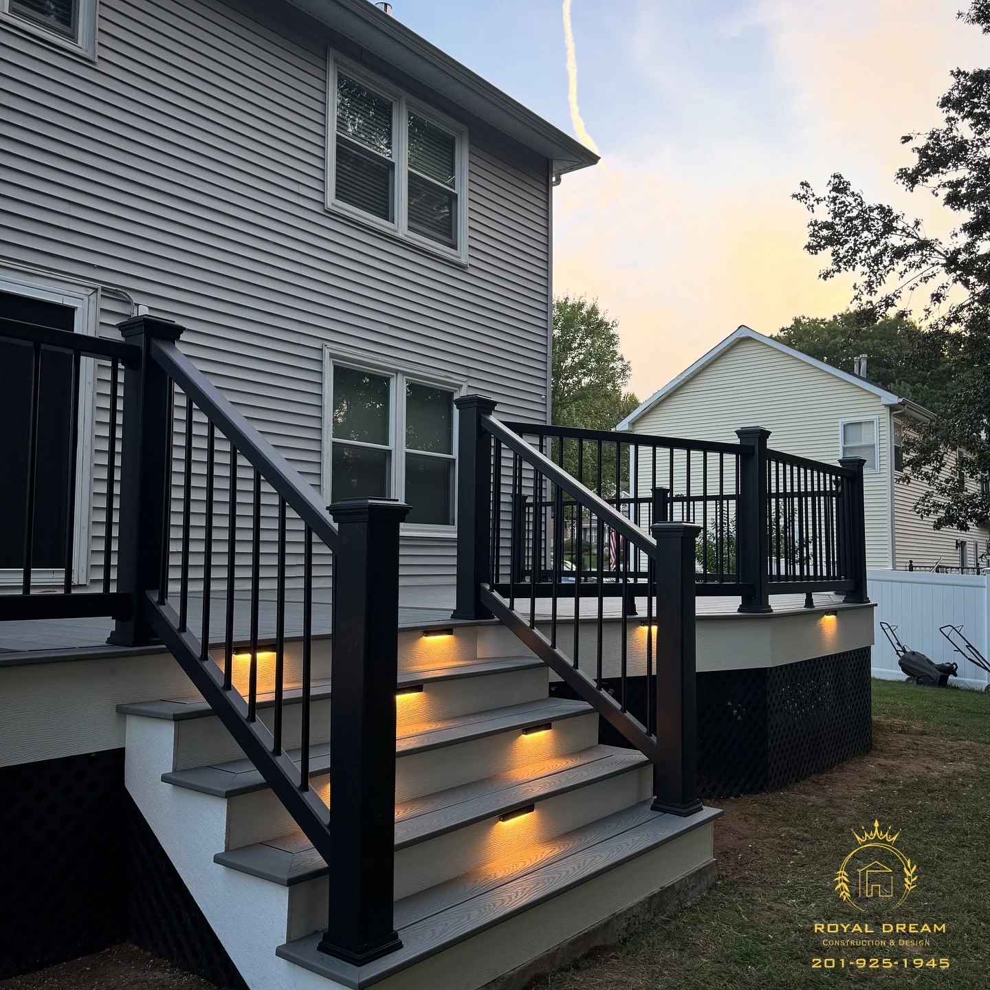The corner staircase and deck lighting bring a warm glow to the finished project.