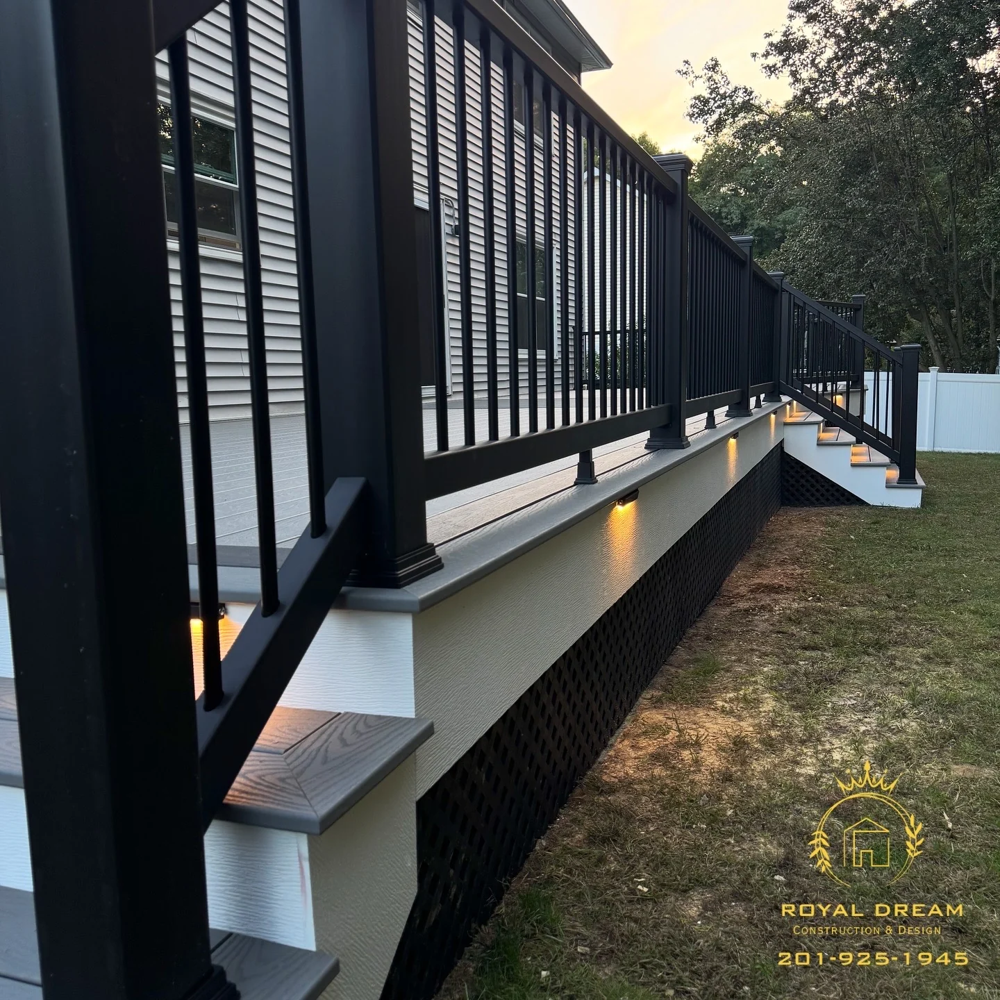 Warm lights along the white fascia finish the deck exterior.