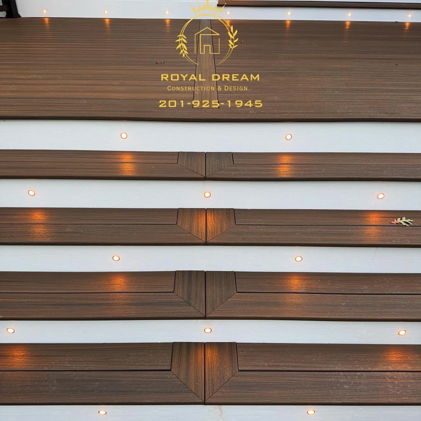 A close look at the board grain, contrasting risers and integrated stair lights.